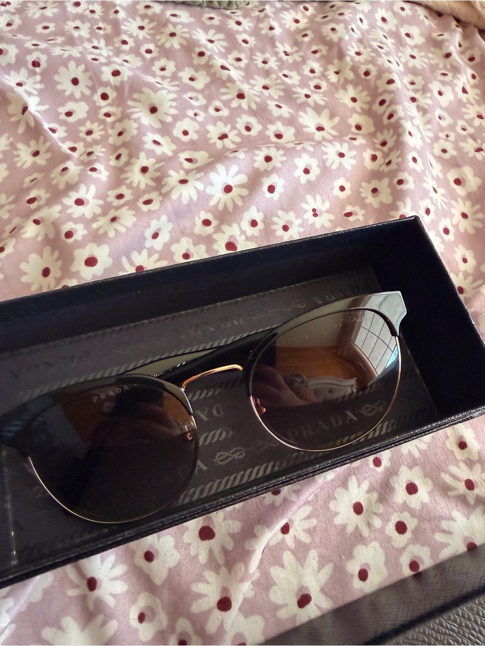 Prada Women’s Black Sunglasses with Gold Trim